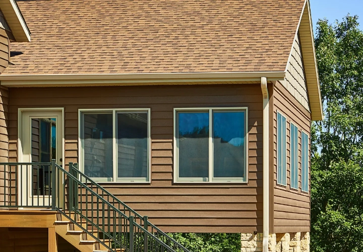 Photo of Klauer Steel Siding on a home with windows.